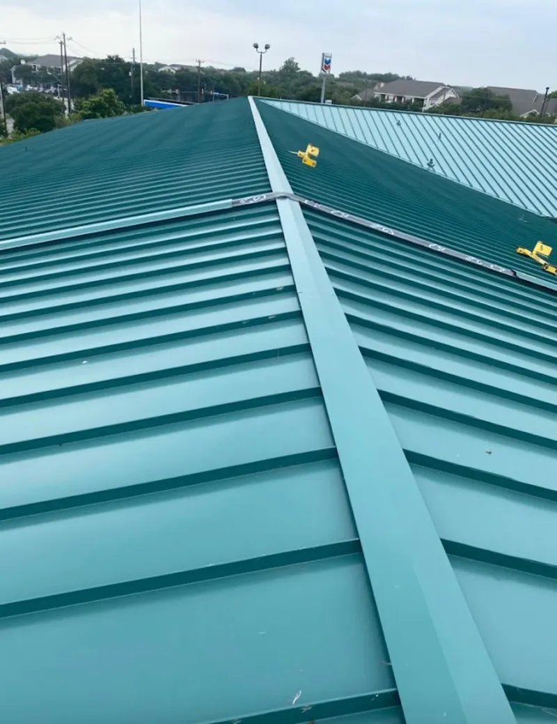 Green commercial metal roof ridge and valley for Metal Roof Repair in Butte-Silver Bow